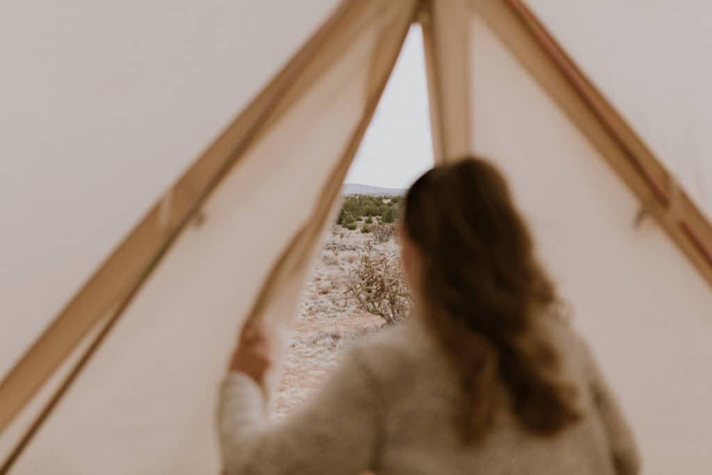 Girl Looks out of Tent at Desert View